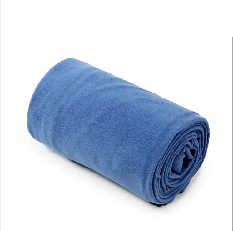 Yellow Pandora lightweight polar fleece camping sleeping bag spread open, showing its soft fleece interior and compact design.