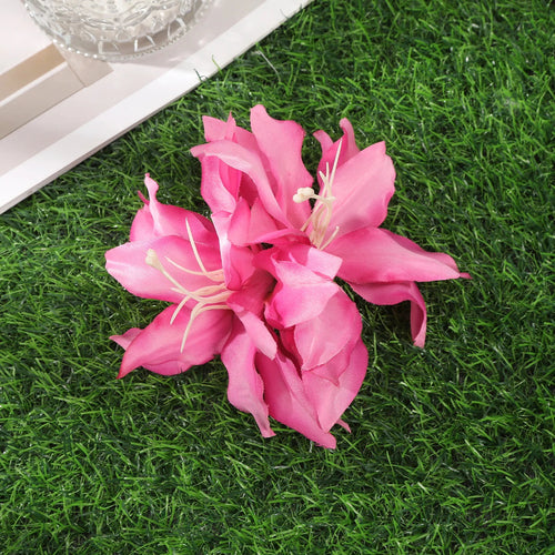 Raspberry Eurybia Away Hawaiian Flower Hair Clip with colorful floral design, perfect for adding a tropical touch to hairstyles.