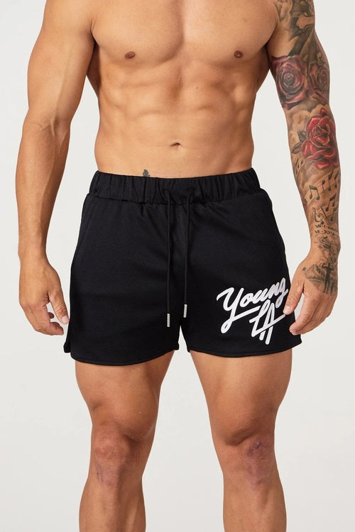 Young LA trendy beach shorts by Raspberry Eurybia, featuring lightweight fabric and vibrant design perfect for summer beachwear.