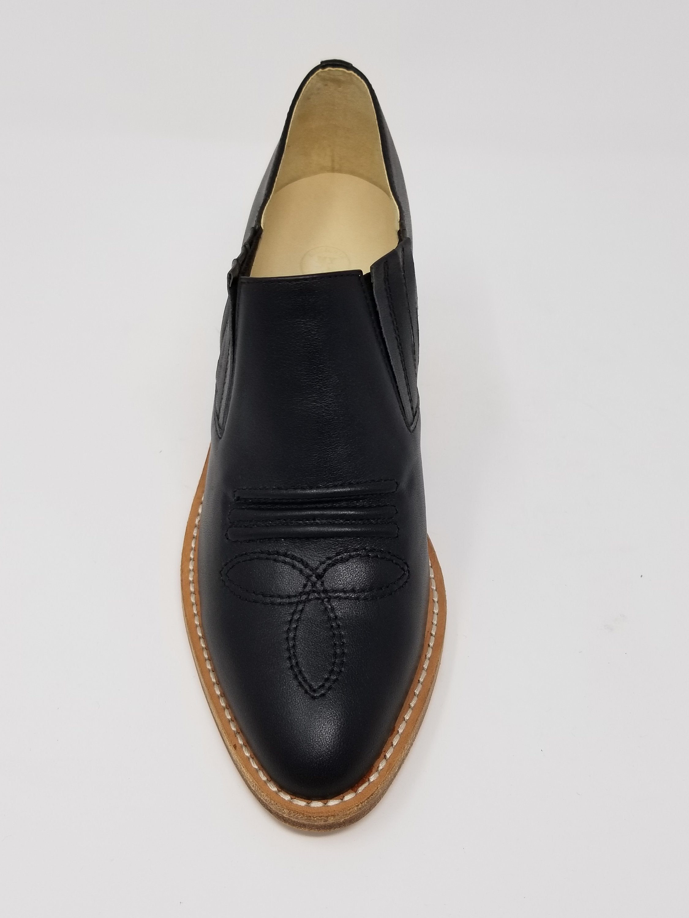 Black Santa Ana footwear by Azure Ophion shown from the front, highlighting its sleek design and stylish silhouette.
