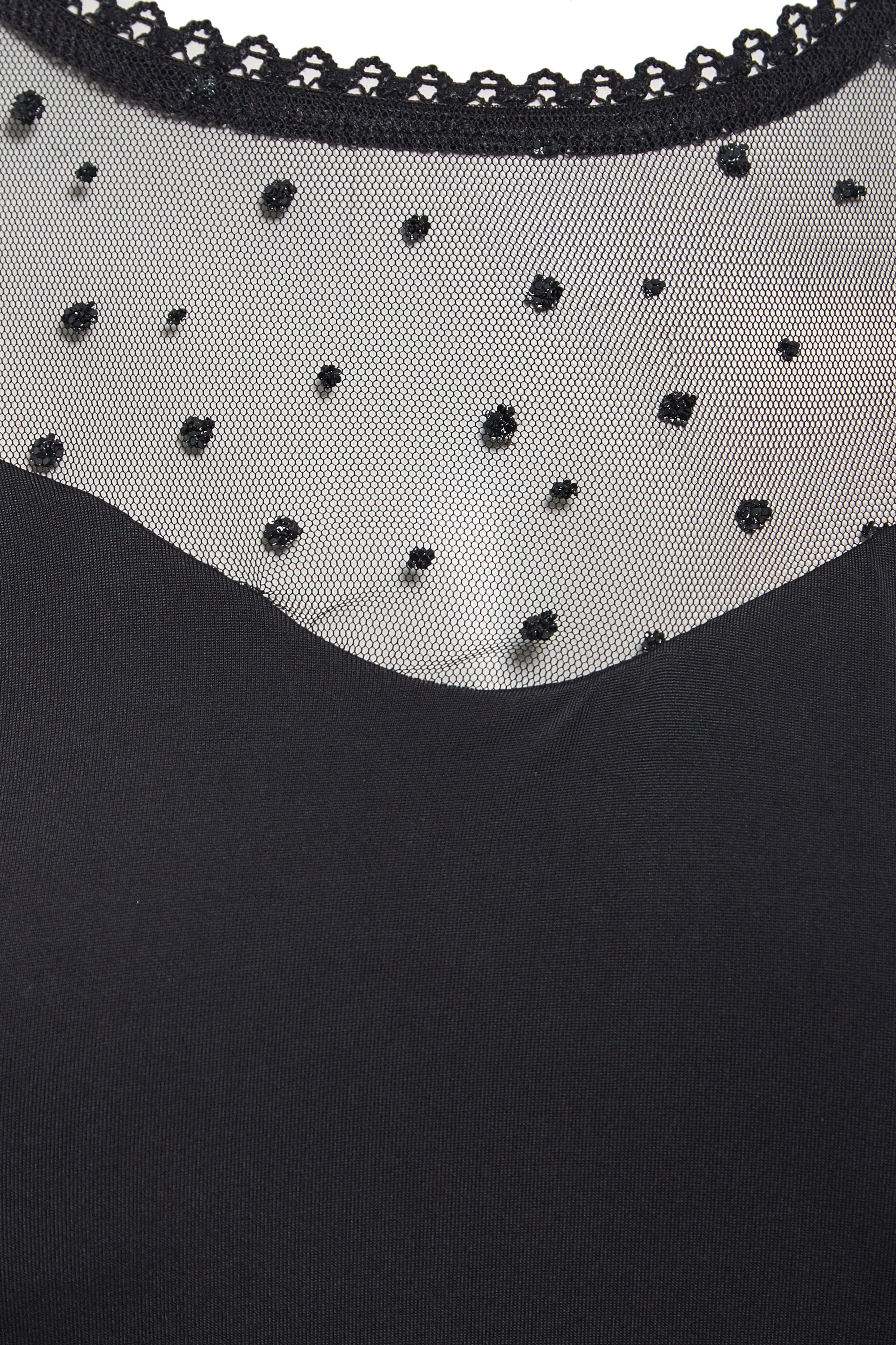 Long-sleeve mesh bodysuit by Blush Athena, featuring sheer fabric and fitted style, displayed on a neutral background.
