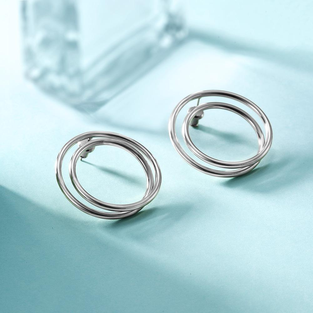 Lavender Phoebe double layered hoop earrings in shiny silver, showcasing their stylish, layered circular design.