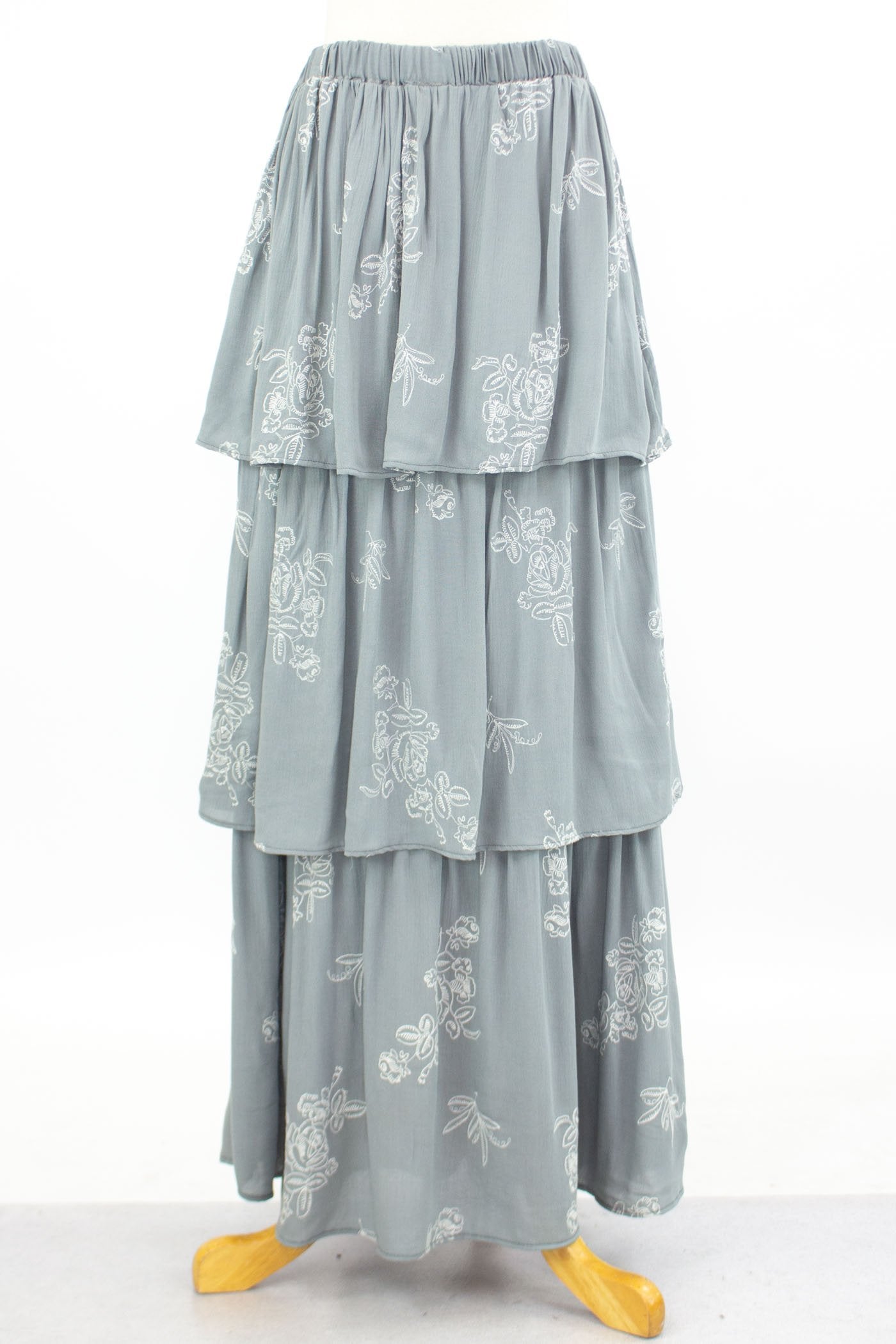 Grey layered ruffle maxi skirt by Yellow Hera, flowing design with tiered fabric, perfect for casual or dressy occasions.