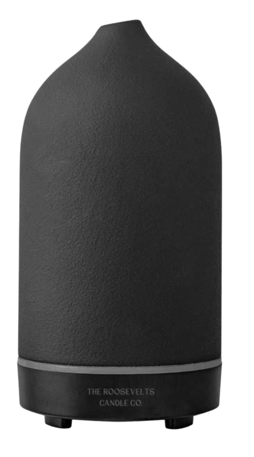 White Dione Stone Aromatic Diffuser with a sleek design, showcasing the diffuser and surrounding essential oils.