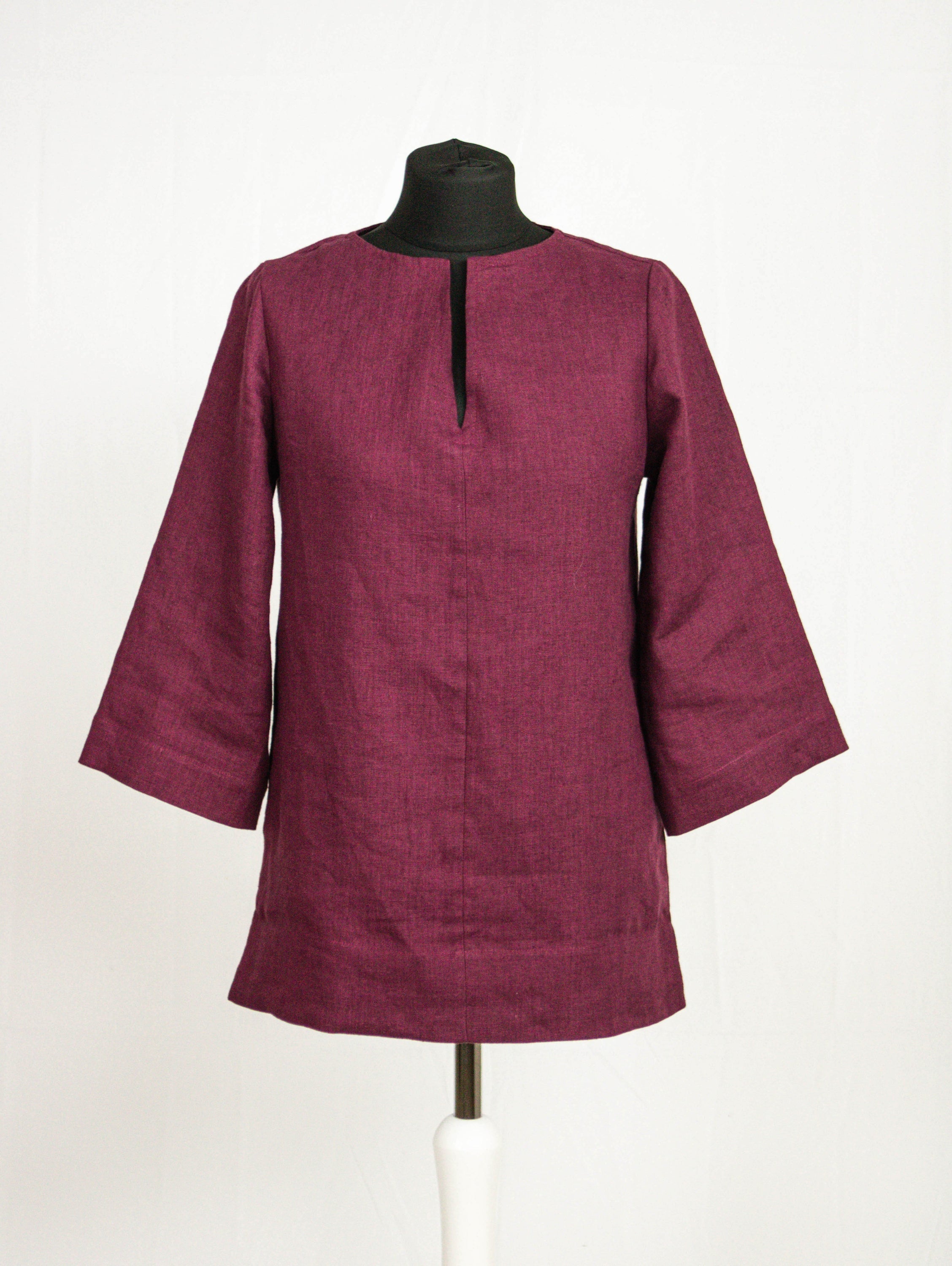 Asphalt grey linen oversize top by Magenta Sugarplum featuring relaxed fit and long sleeves, displayed on a hanger.