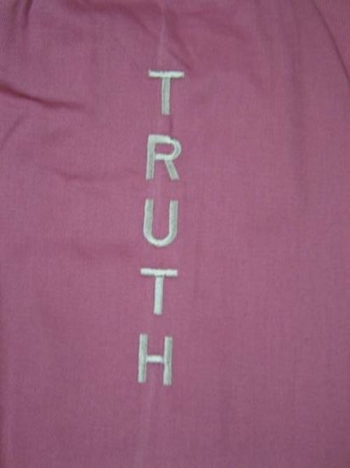 Alabaster OMSutra yoga bag with slogan design, durable fabric, and adjustable strap for carrying yoga mats and accessories.