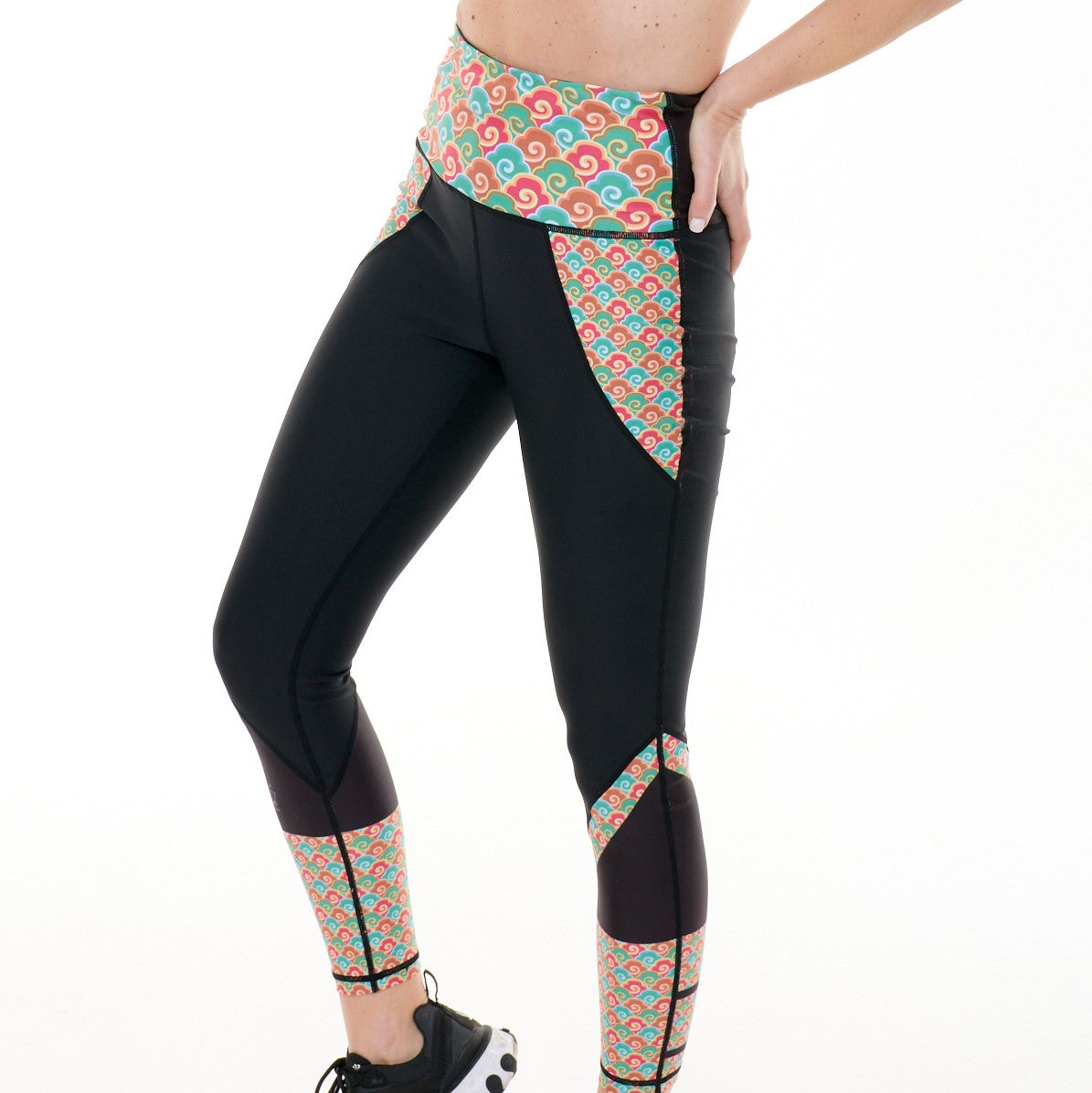 Close-up of White Oliver Heading East Beautiful Leggings showing the stretchy, vibrant activewear fabric with detailed stitching.