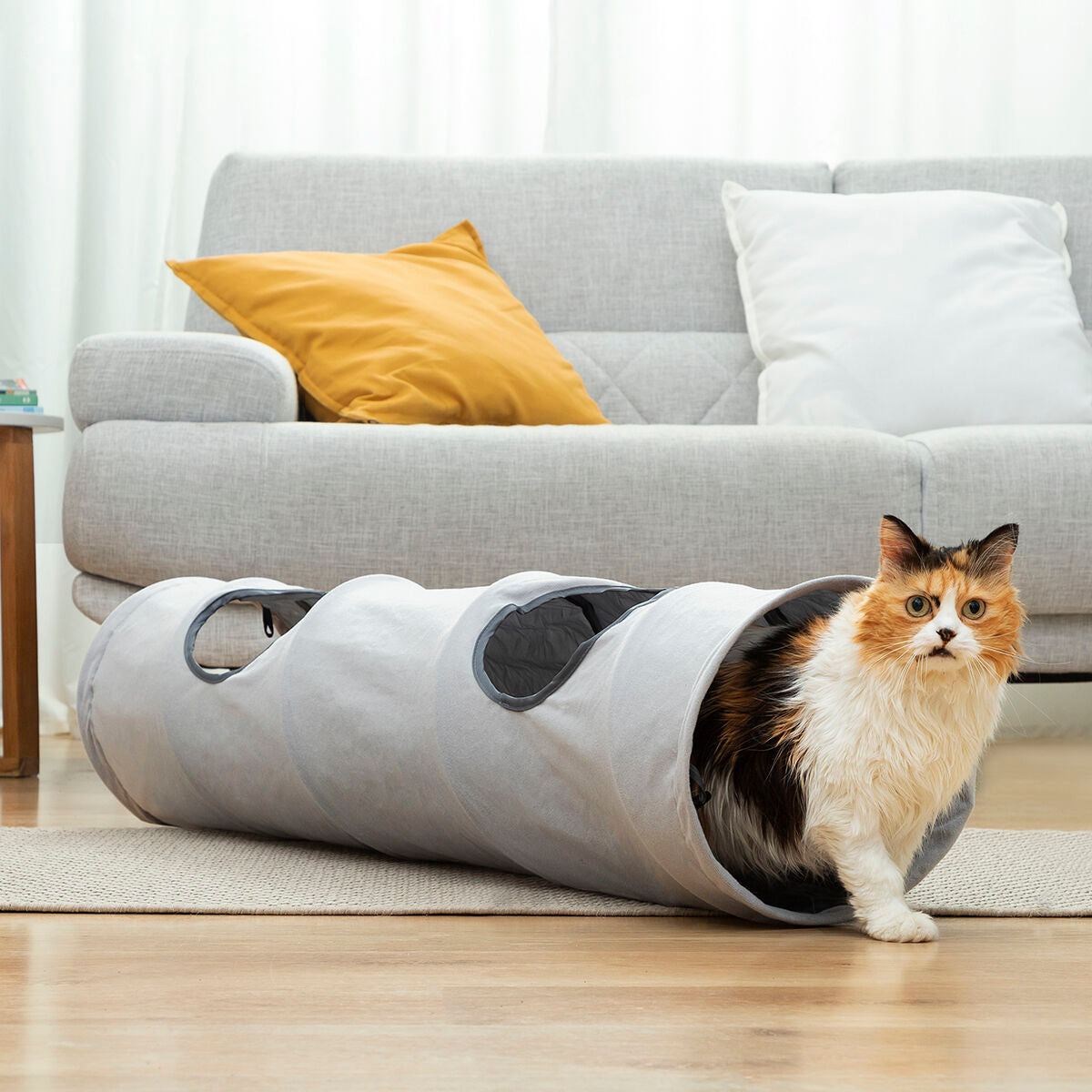 Collapsible pet tunnel from Funnyl InnovaGoods for pets, shown in open position with bright colors and flexible design.
