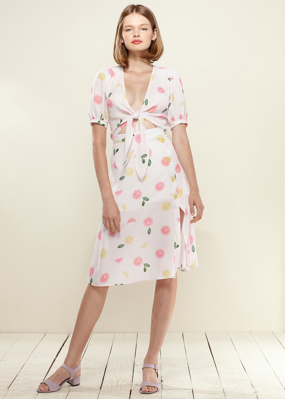 Lemon Hera button front midi skirt in vibrant Fruit Punch color, featuring a stylish midi length and front button details.