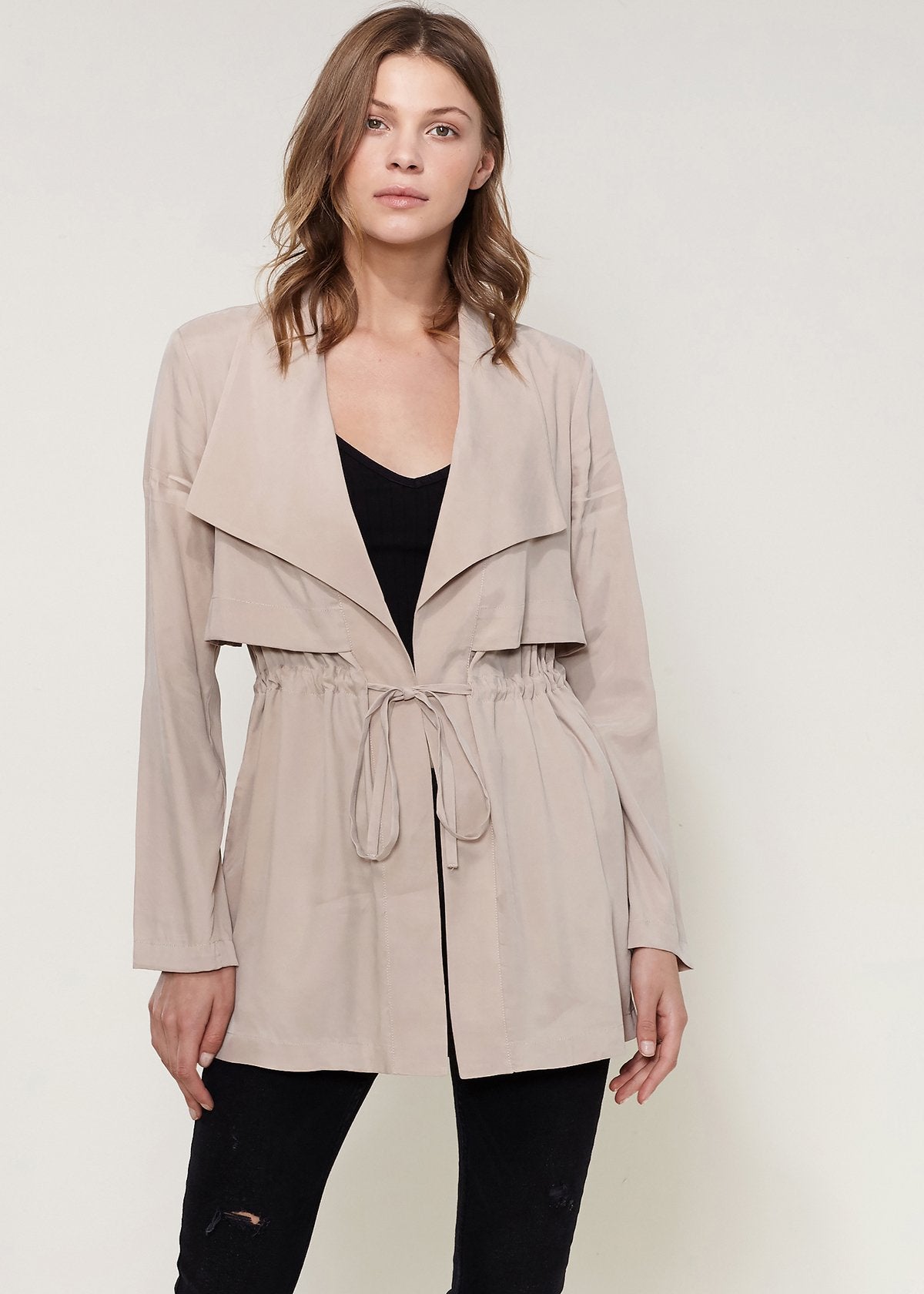 Lemon Hera Ro&de Noir open front taupe jacket, stylish and lightweight, displayed on a hanger with a soft fabric texture.