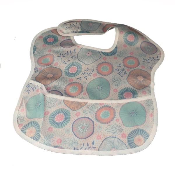 Pink and blue paisley waterproof baby bib with crumb catcher from Raspberry Pallas, made of denim-style material.