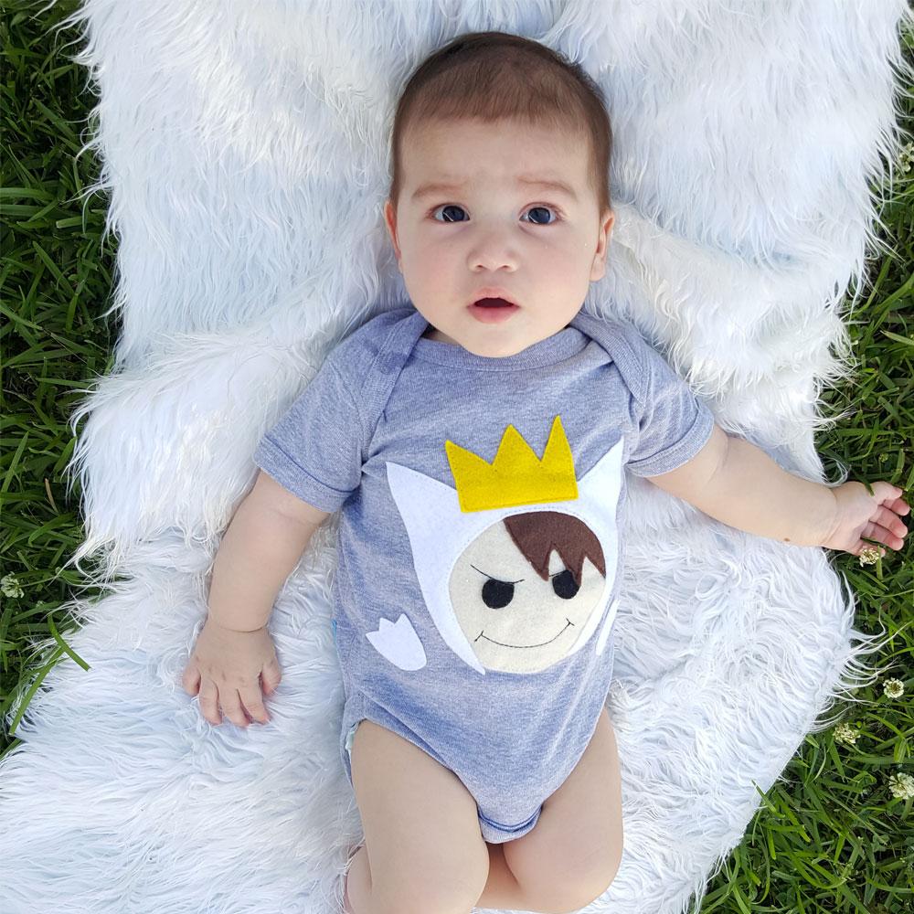 Sky Blue Milo baby onesie with wild animal print, designed for kids and babies, featuring playful and comfortable clothing for little boys.