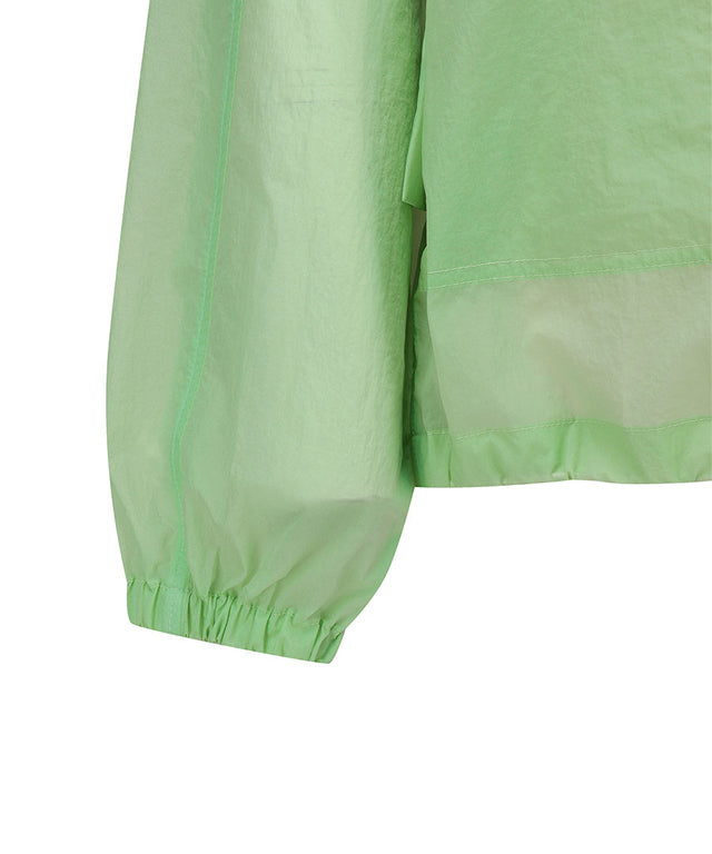 Light green women’s Stingray fit jacket with shirring details by Amethyst Lucy, styled as a golf accessories piece.