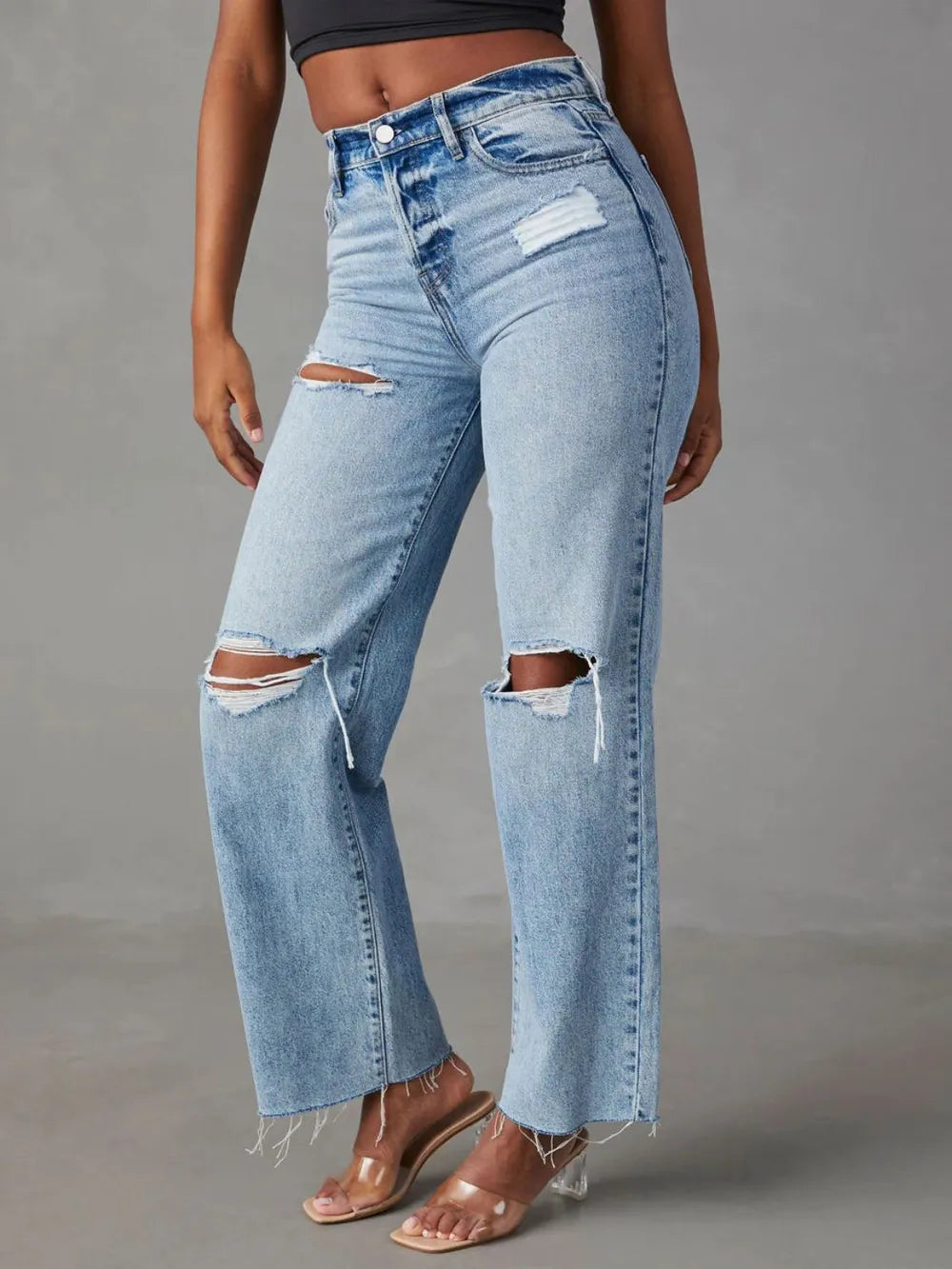 Pear Daisy distressed straight leg jeans with pockets, casual denim pants, showcasing a worn-in style and functional front and back pockets.
