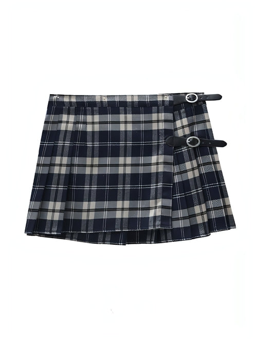 Carmine Juneberry pleated skirt with flowing fabric and midi length, styled on a model showcasing its elegant design.