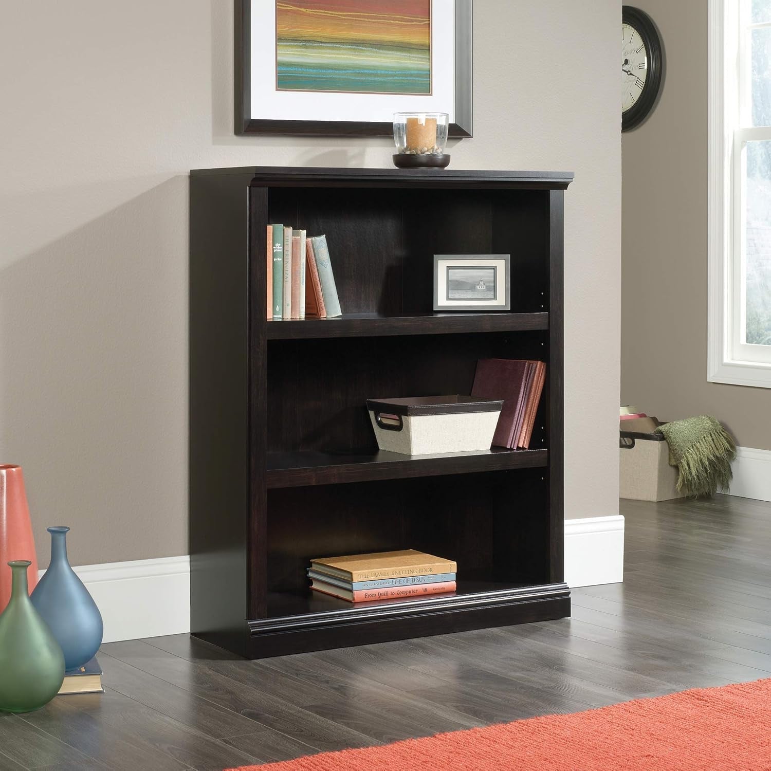 Three-tier wooden bookshelf in estate black with adjustable shelves by Peach Maple, showcasing a modern furniture design.