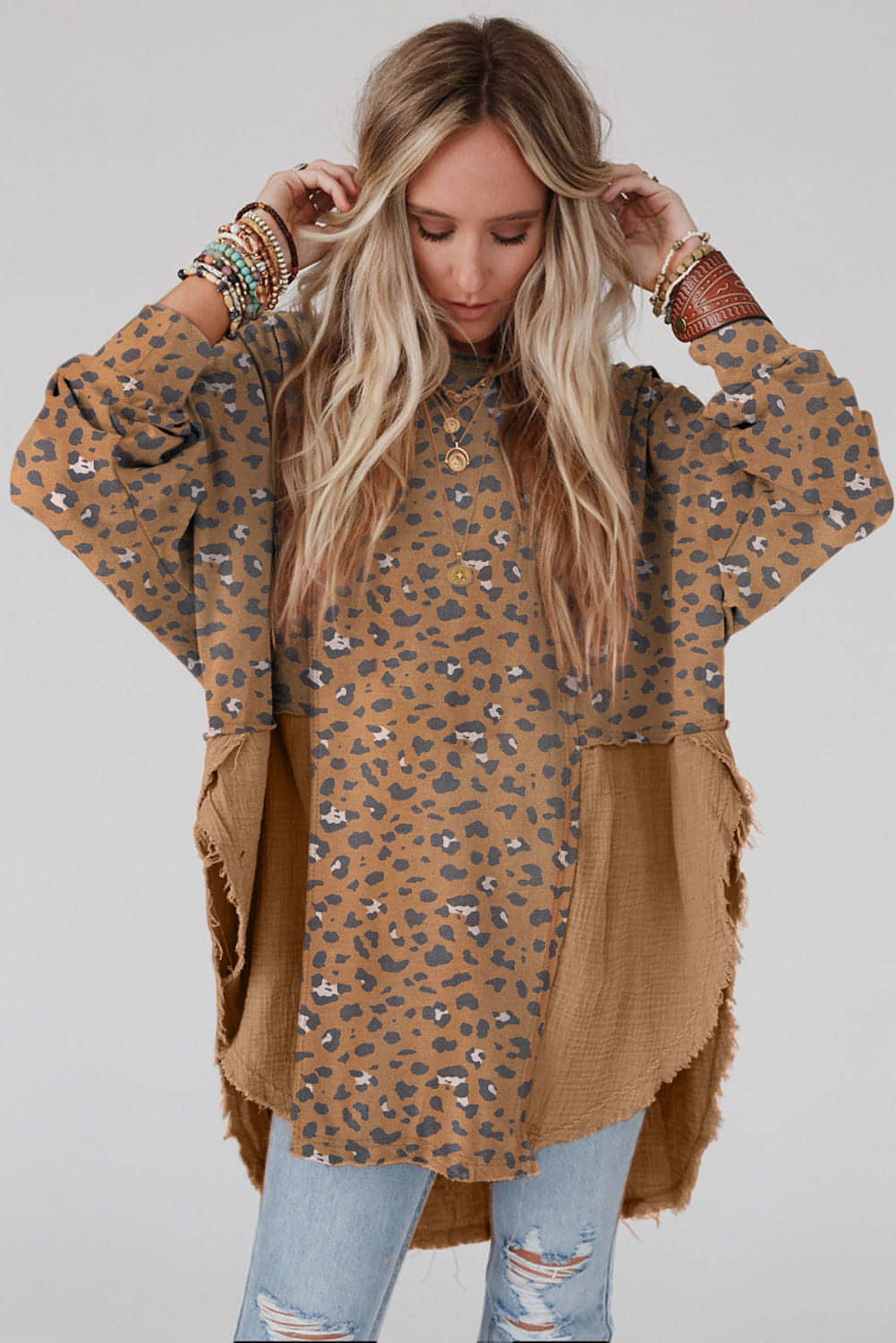 Brown printed raw edge leopard patchwork oversized blouse by Carmine Juneberry, featuring bold animal print and relaxed fit.