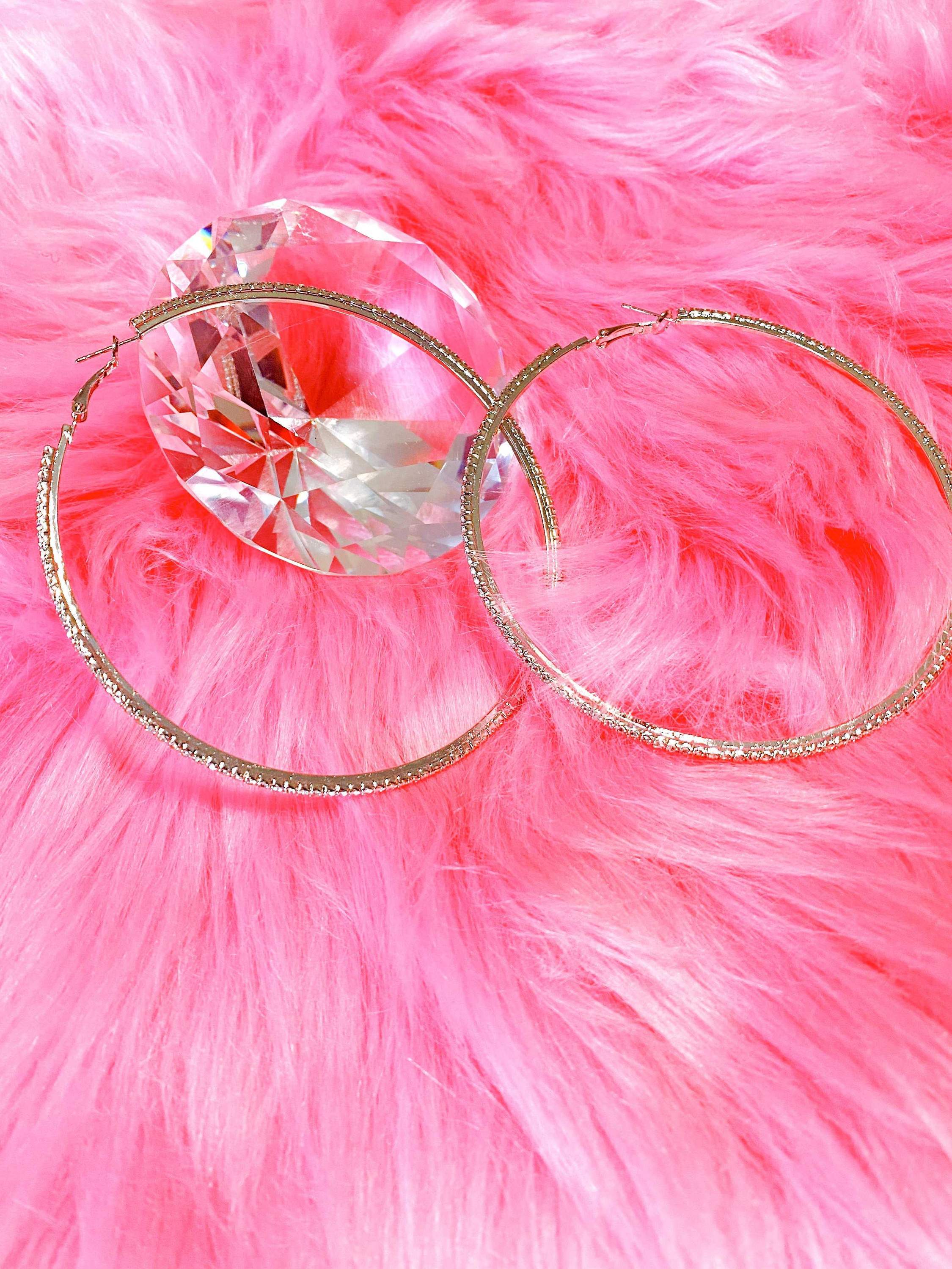 Burgundy Uranus hoop earrings, Around The Way Girl style, featuring bold circular design for a trendy accessory look.