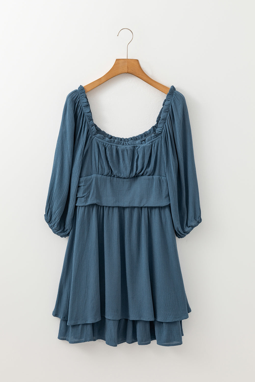 Solid ruched frilled neck 3/4 sleeve dress by Byzantium Bay, featuring a stylish design with gathered fabric and a feminine silhouette.