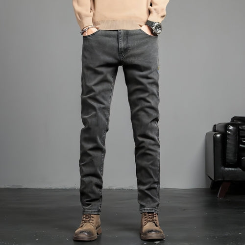 Youth retro embroidered denim pants for men by Carmine Juneberry, featuring classic blue jeans with colorful embroidered details.