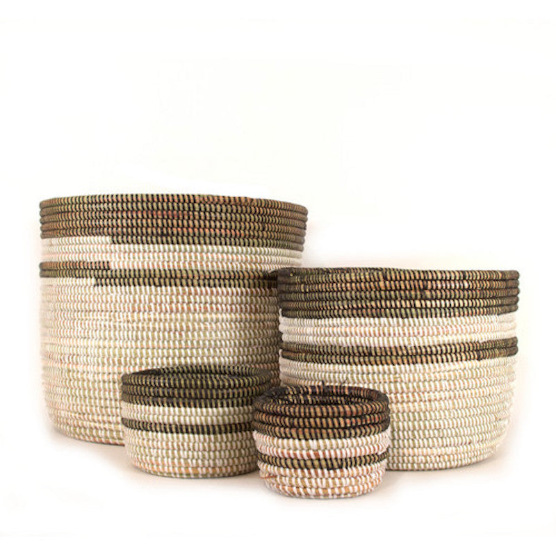 Group of Start2Finish basket planters with woven designs and various plants, ideal for outdoor or indoor decorating.