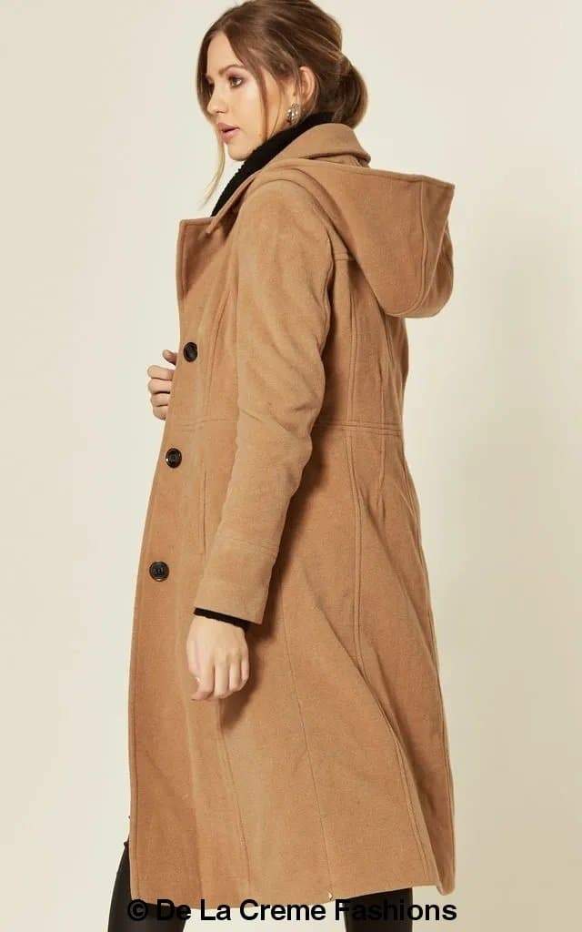 Beatrice Rose Eleusis wool blend hooded mid-length coat displayed on a hanger, showcasing its cozy design and neutral color.