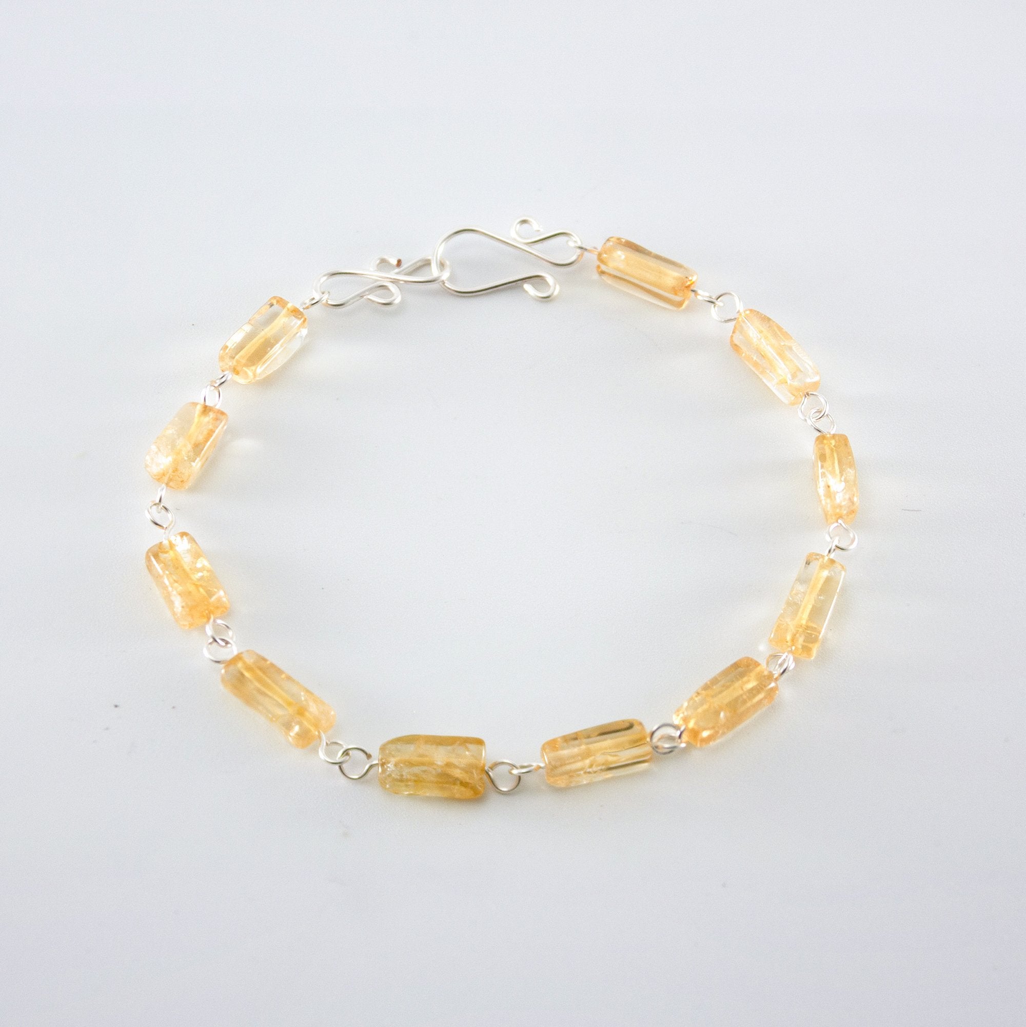 Silver Citrine rectangular link bracelet from Grey Clymene with polished citrine stones and silver chain links.
