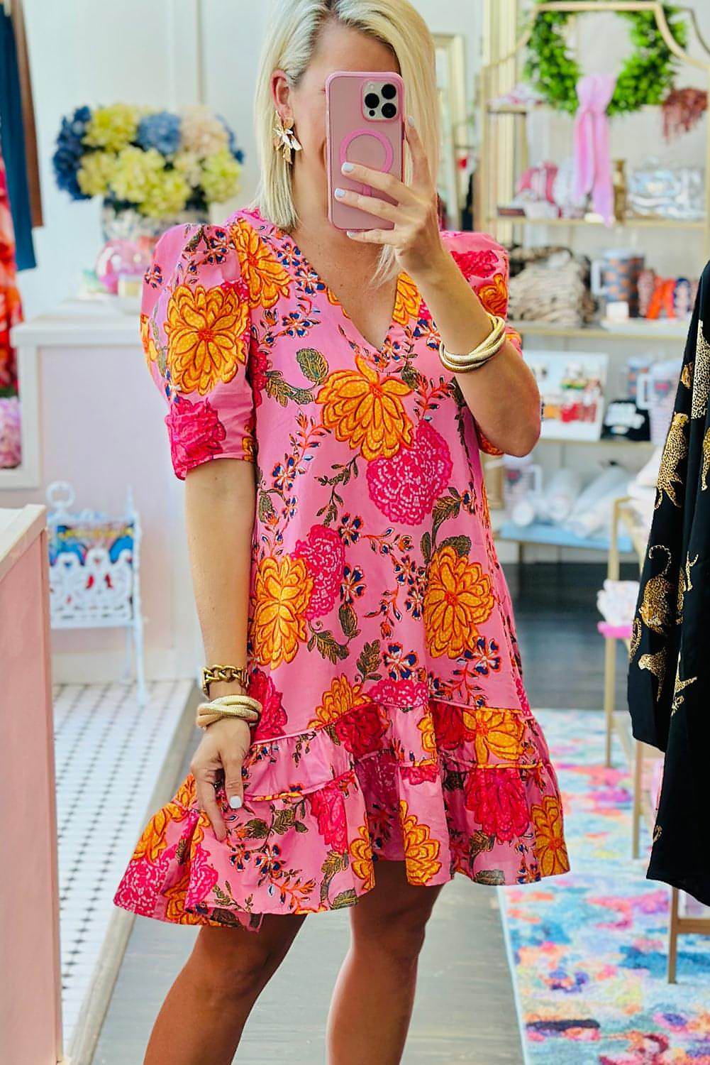 Pink floral bubble sleeve V-neck ruffled mini dress by Carmine Juneberry, featuring a feminine design with floral patterns and ruffled details.