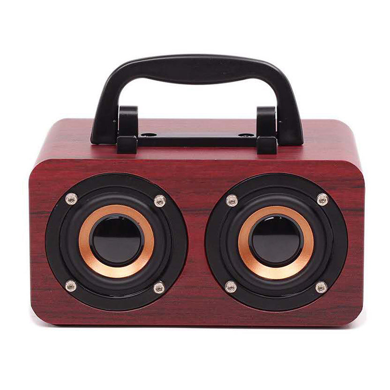 Maroon Asteria portable wooden Bluetooth speaker for outdoor use, compact design with built-in controls and natural wood finish.