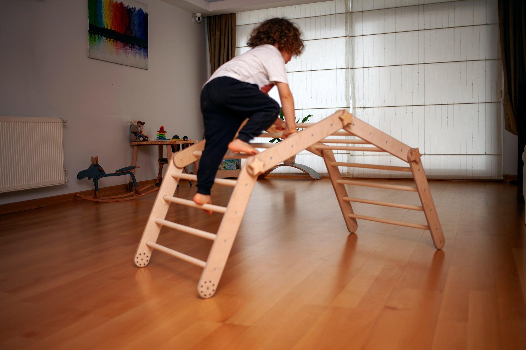 Red Oceanus transformable climbing cube with ramp, a versatile furniture piece designed for climbing and play.