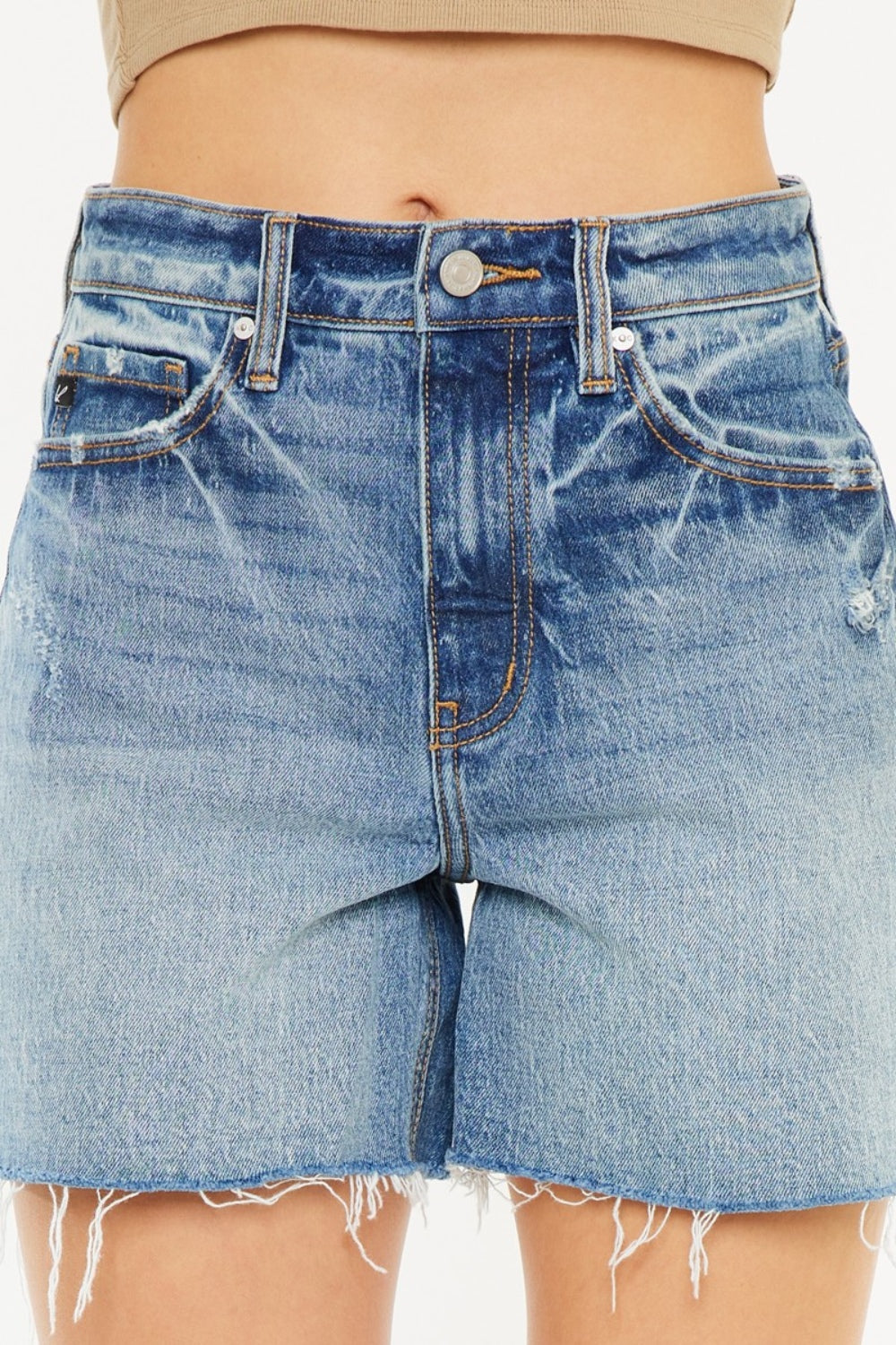 Jade Icarus Kancan high waist denim shorts with raw hem, showcasing fitted style and light blue denim fabric.