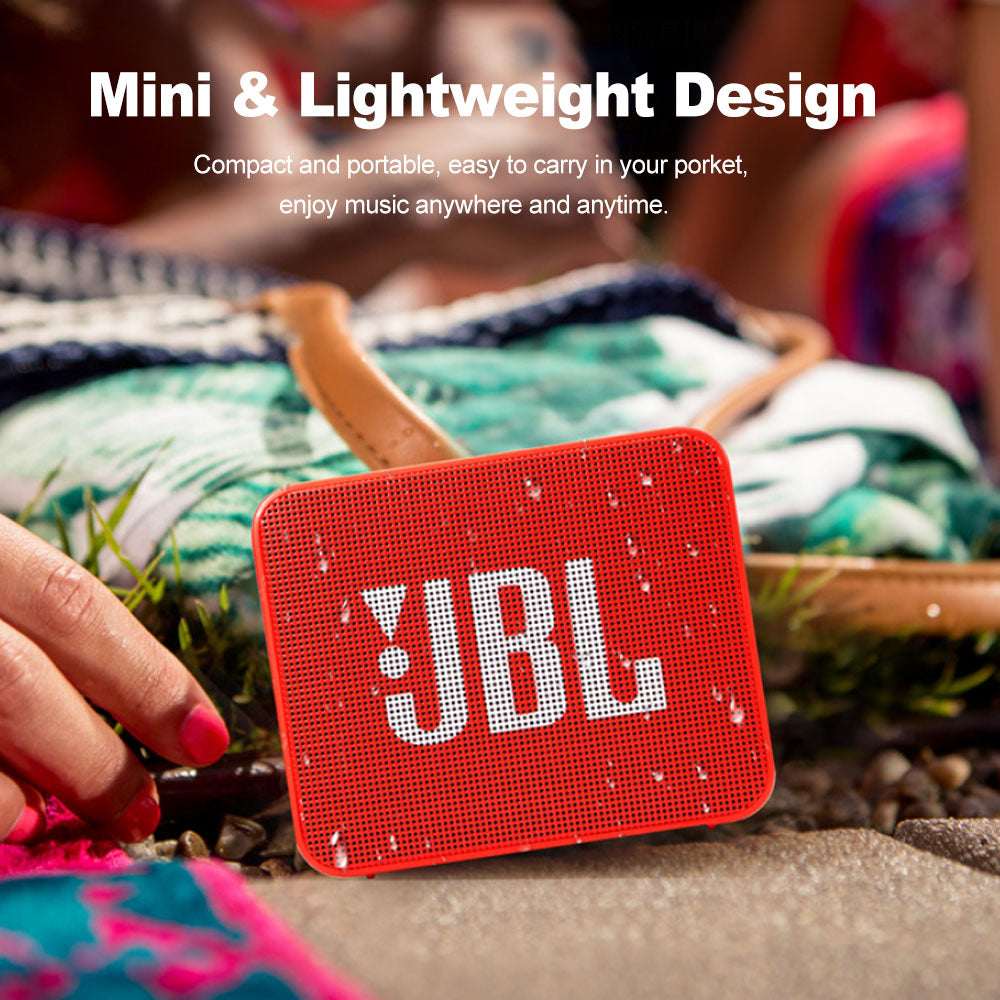 Teal Simba JBL GO 2 wireless Bluetooth speaker with IPX7 waterproof design and built-in microphone, portable audio device.