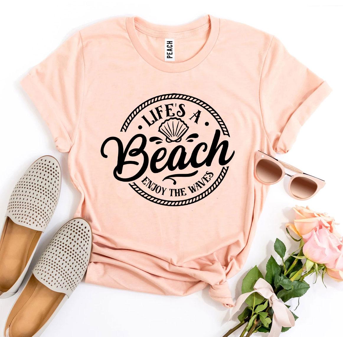 Agate Life’s a Beach Enjoy The Waves T-shirt featuring a beach and wave graphic in a casual, stylish design.