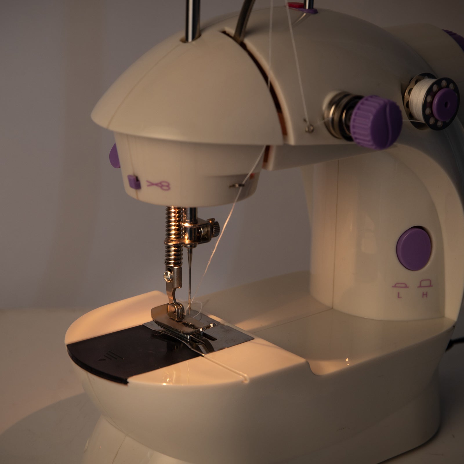 Lilac Milo portable desktop household sewing machine with extension table for home sewing projects, compact and easy to use.