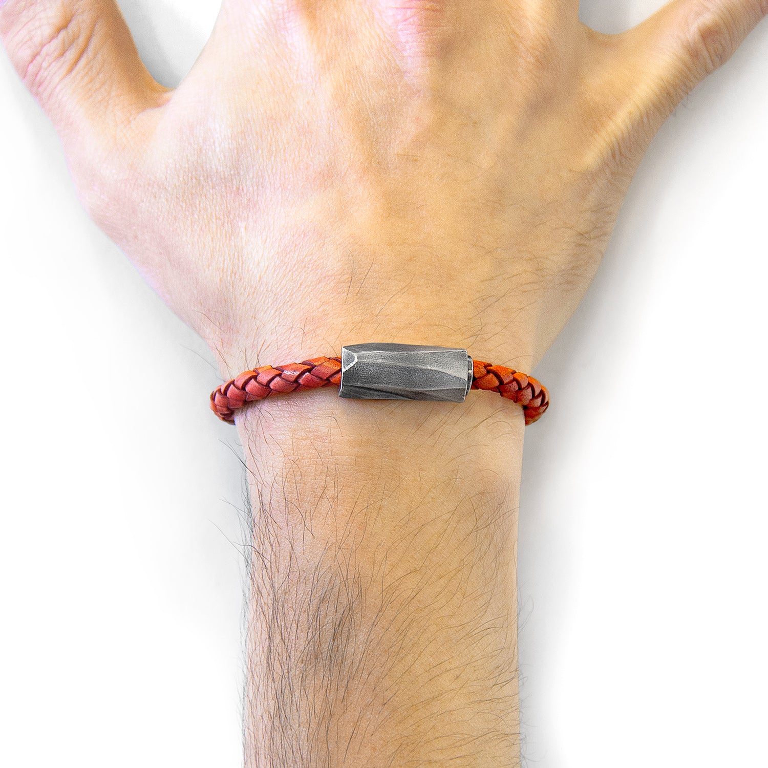 Amber red Hayling silver and braided leather bracelet by Magenta Sooty, featuring a combination of silver accents and leather weaving.
