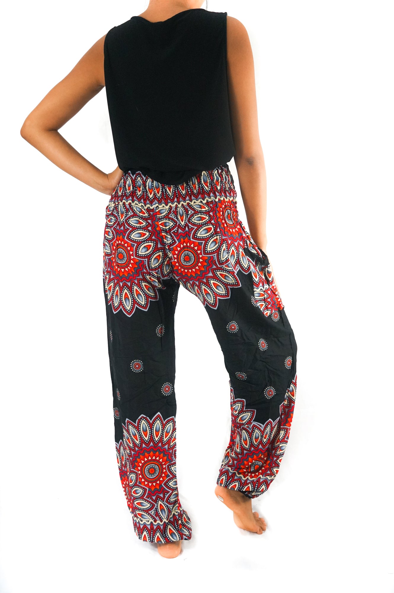 Black floral harem pants for women by Tan Smokey, featuring boho, hippie style with relaxed, flowy fabric and floral patterns.