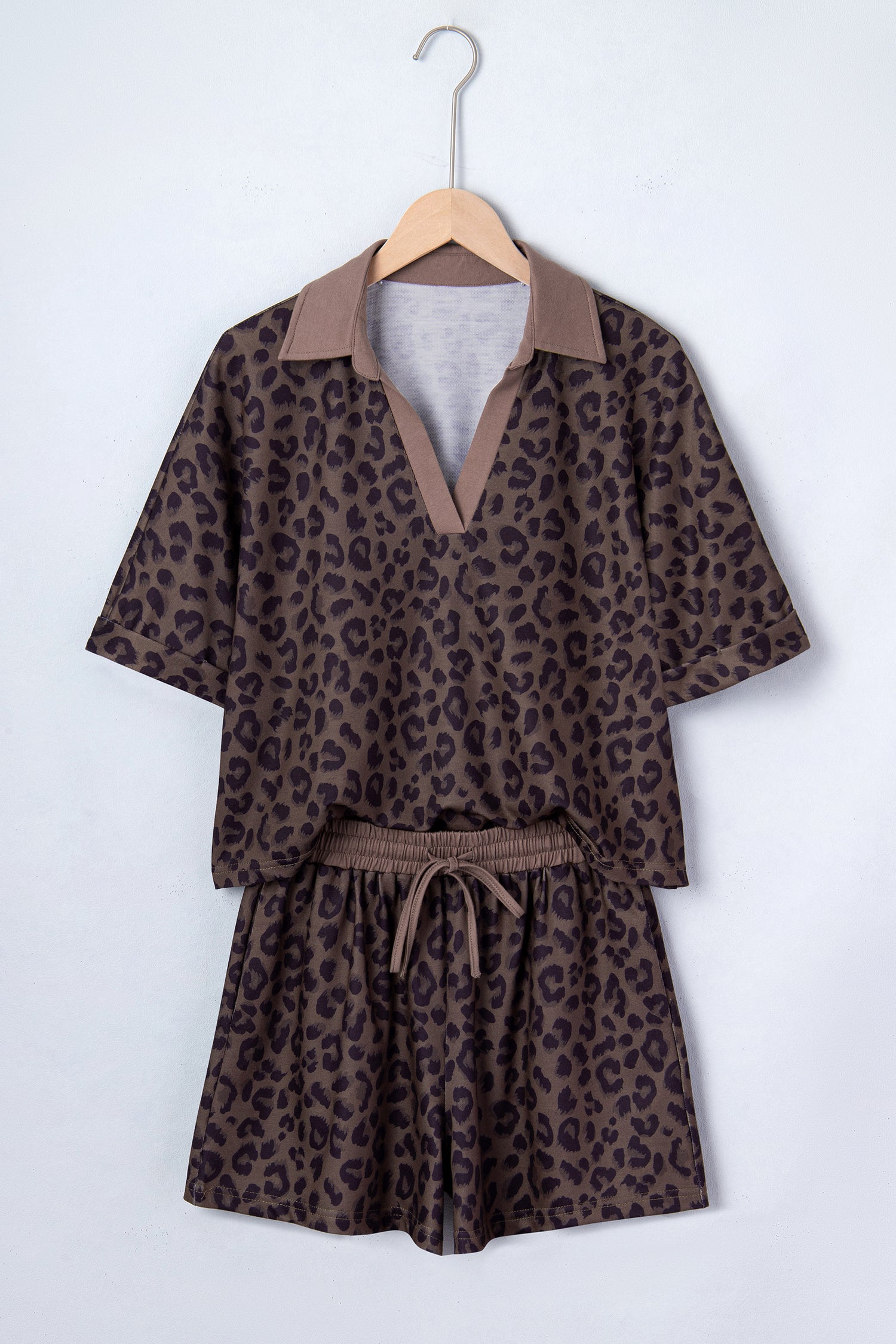 Byzantium Bay leopard print collared V-neck top and matching shorts set displayed on a model, casual summer outfit.