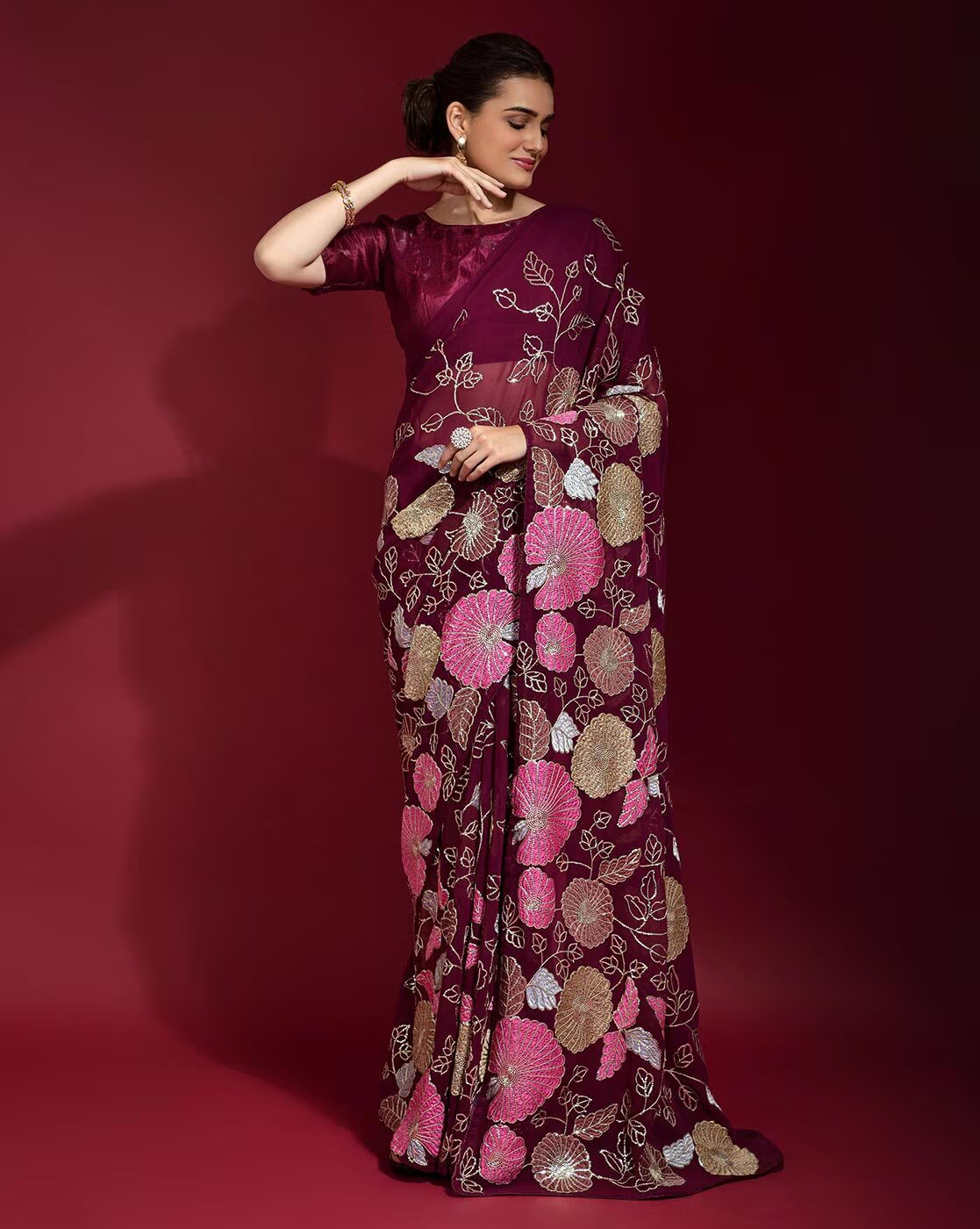 Women’s printed saree from Amethyst Alcestis, featuring colorful floral patterns and lightweight fabric, perfect for traditional occasions.