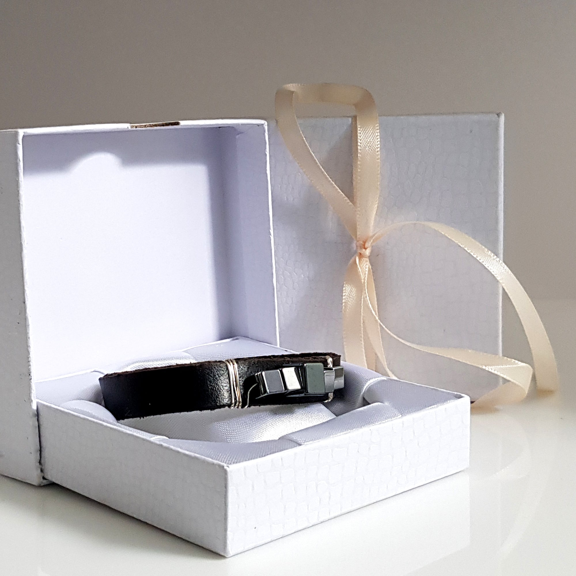 Large black leather and hematite band bracelet by Maroon Smudge, featuring a sleek, modern design with bold metal accents.