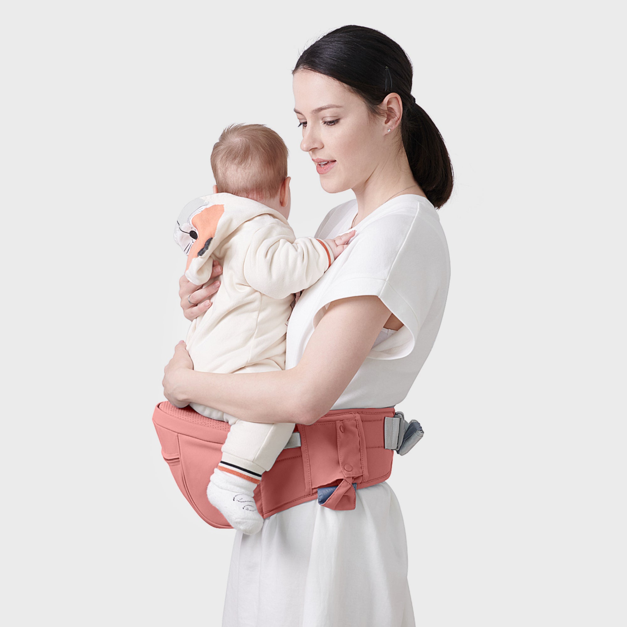 Maroon Chronos ergonomic hip seat with cushioned support, designed for parent comfort and ease of carrying.