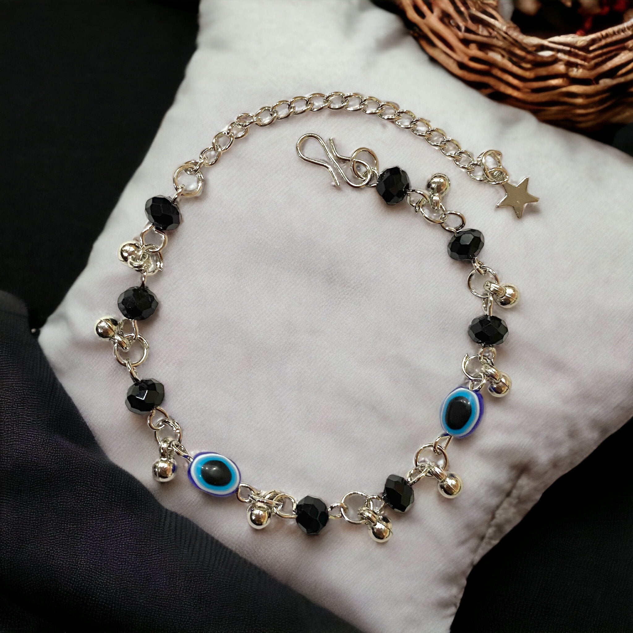 Gray Poseidon Fortune’s Shield Evil Eye bracelet featuring a silver and blue beaded design with a protective evil eye charm.