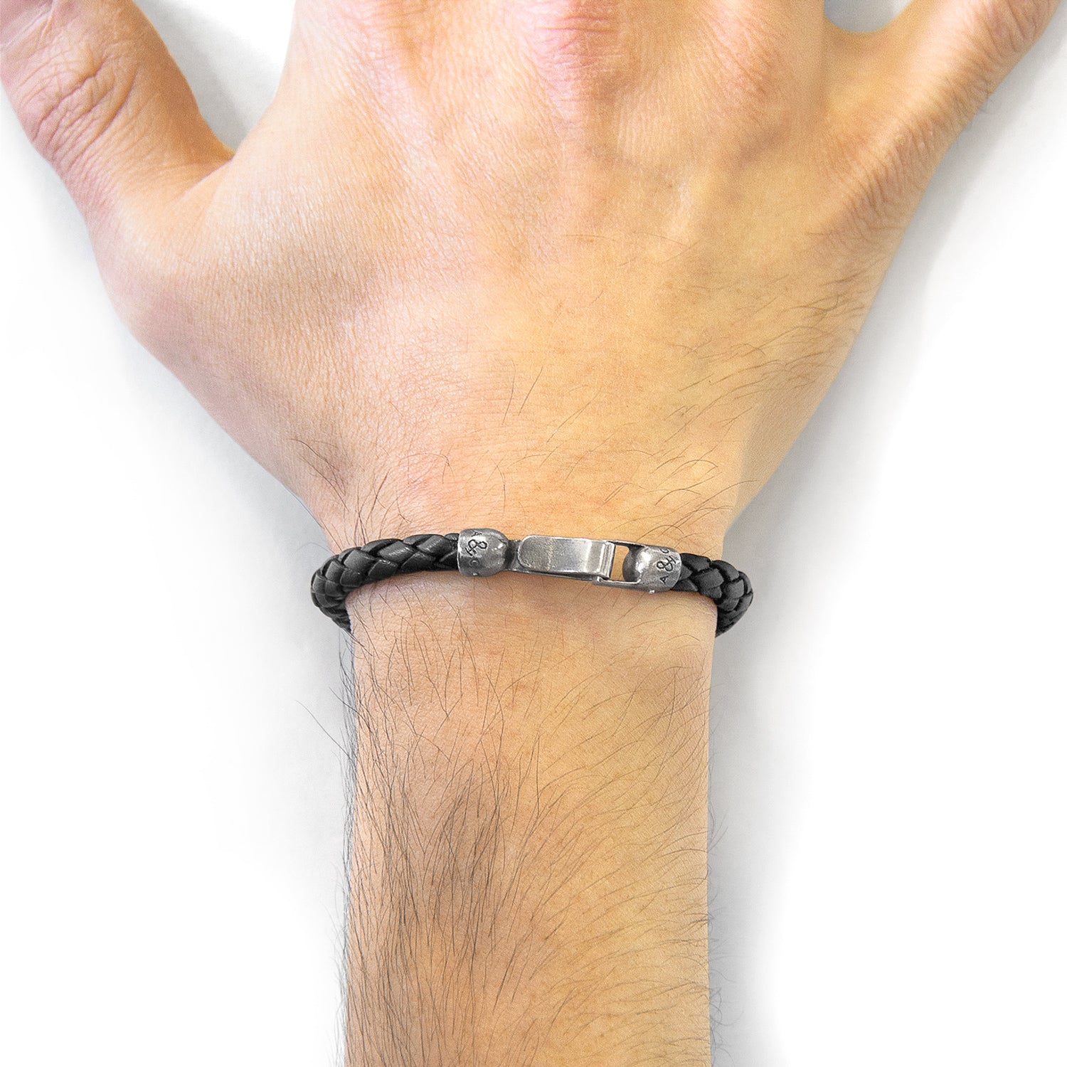 Midnight black Skye silver and braided leather bracelet by Magenta Sooty, featuring silver accents and woven leather strap.