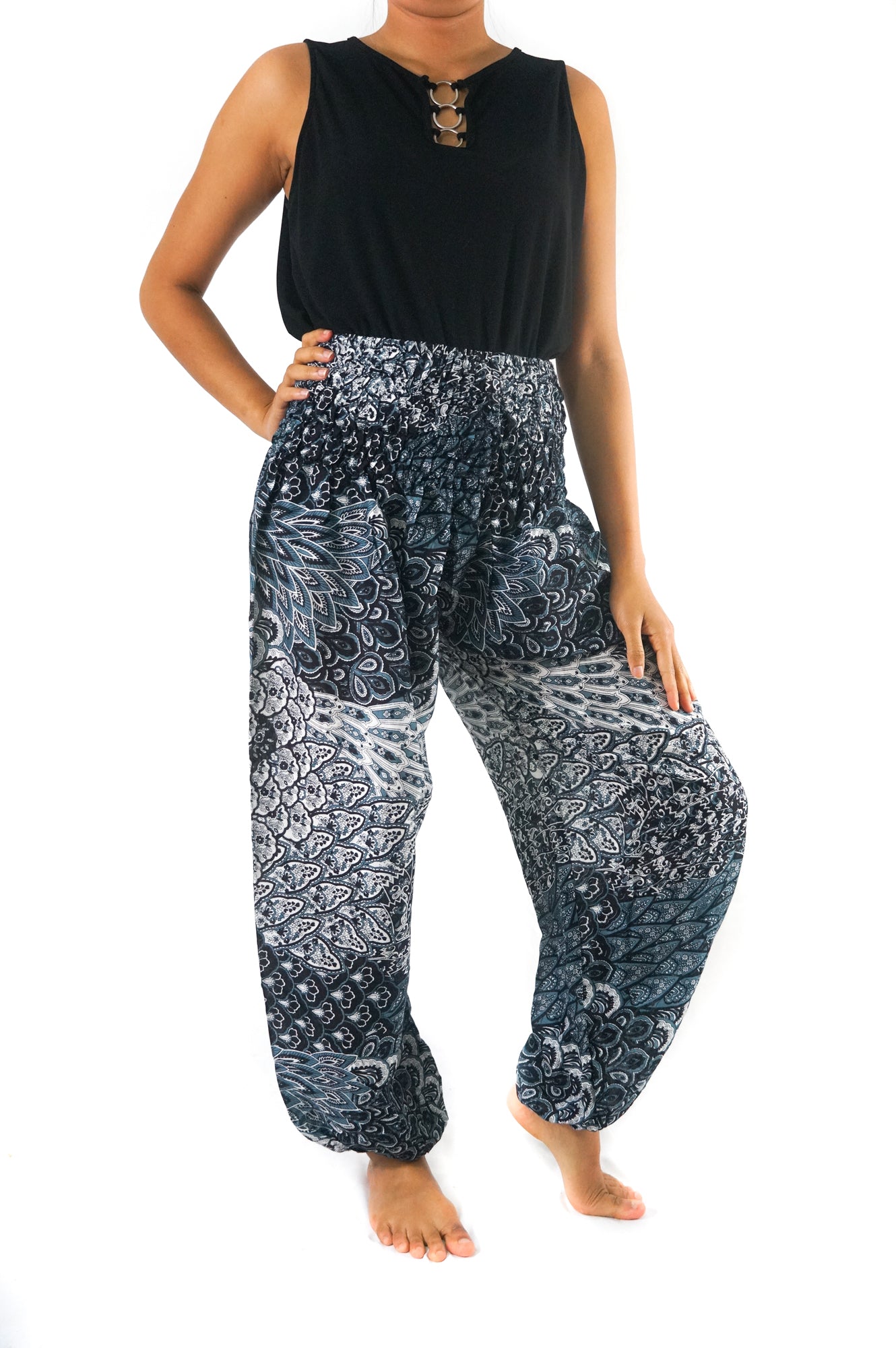 Black peacock print boho pants for women by Tan Smokey, featuring hippie style and comfortable yoga-inspired design.