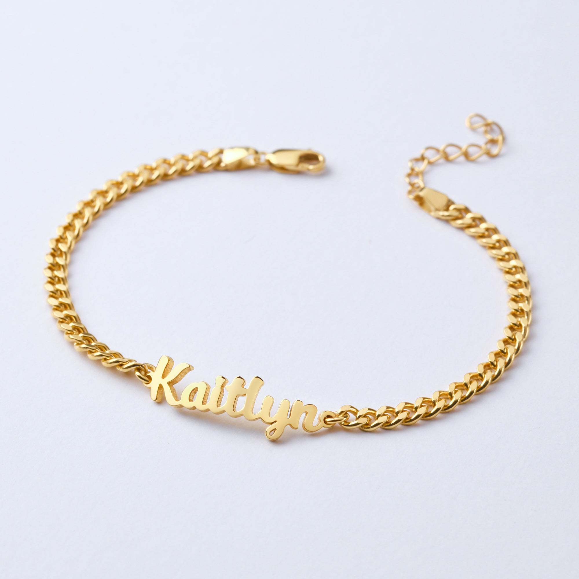 Child name bracelet by Green Millie featuring a delicate baby girl jewelry design with personalized name charm and colorful beads.