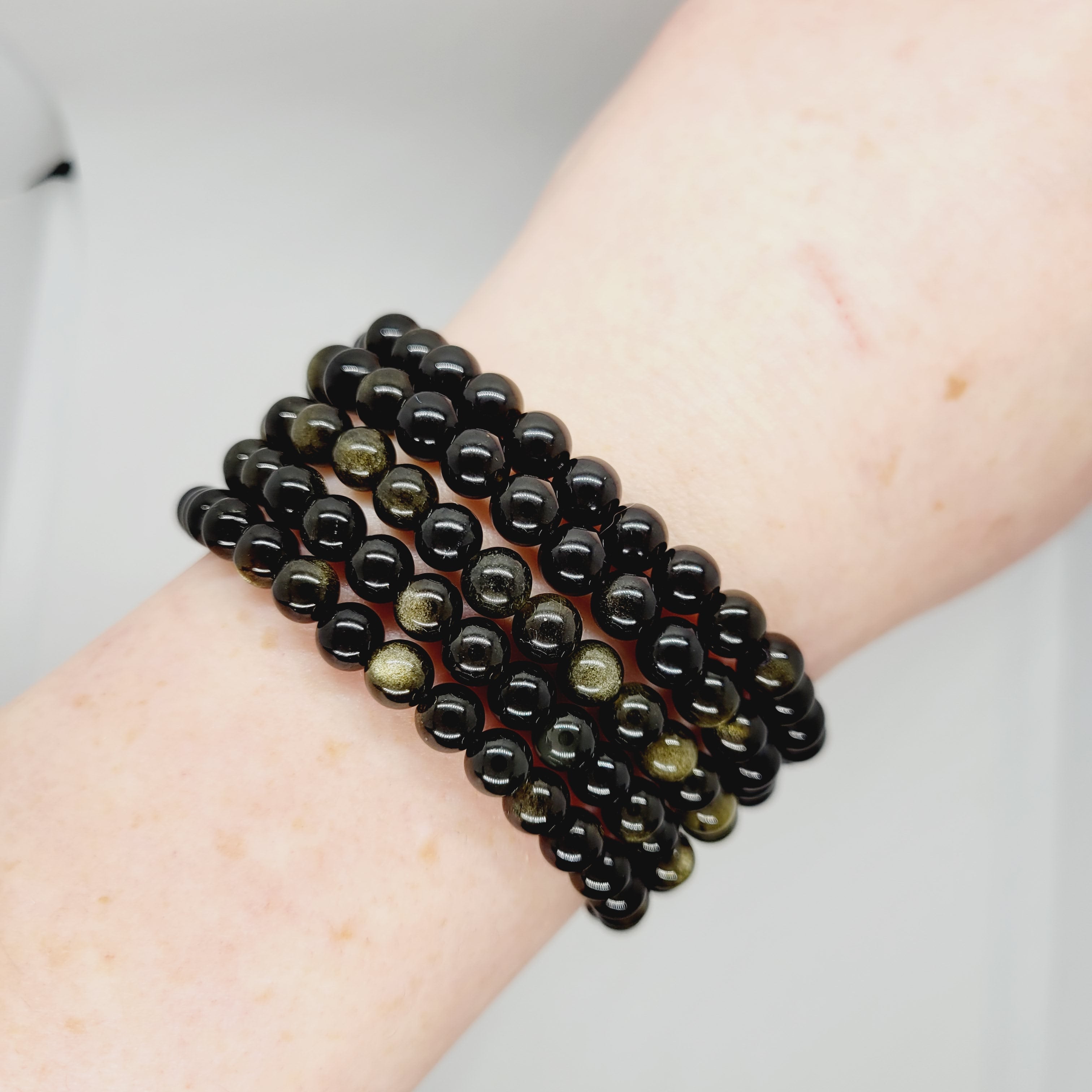 Gold sheen obsidian stone bracelet from Olive Coeus featuring polished beads in a boho style, ideal for metaphysical and Reiki practices.