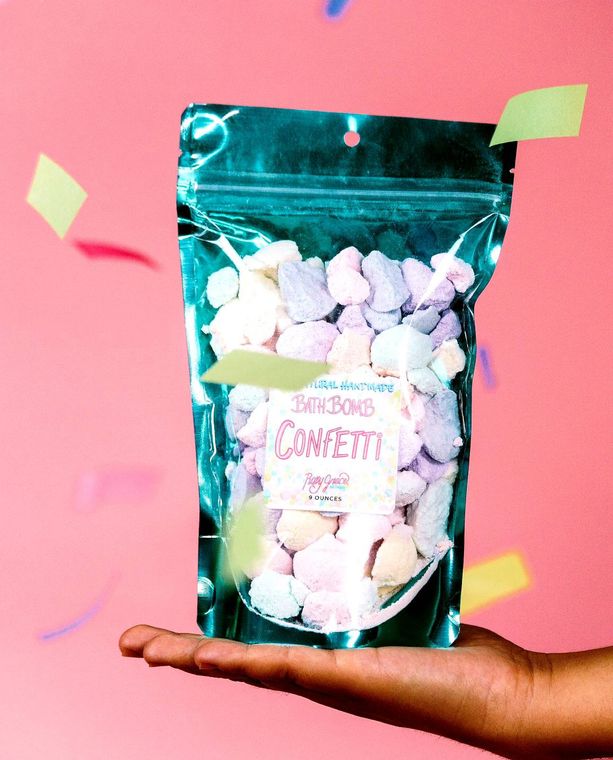 Colorful Orchid Missy Bath & Beauty Bath Bomb Confetti with vibrant, festive bath bomb pieces in a close-up shot.