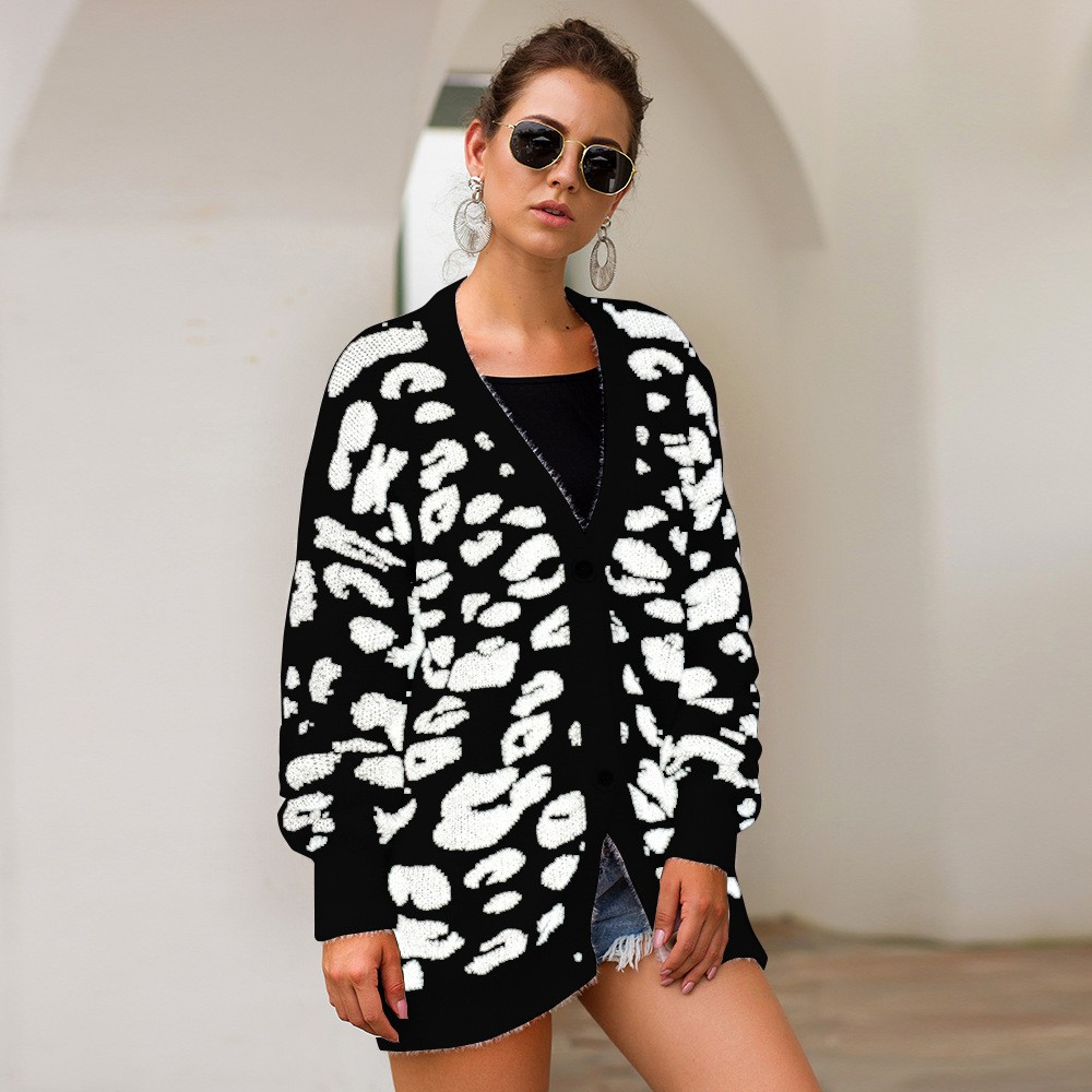 Carmine Juneberry leopard print long sleeve small cardigan sweater with button closure and ribbed cuffs.