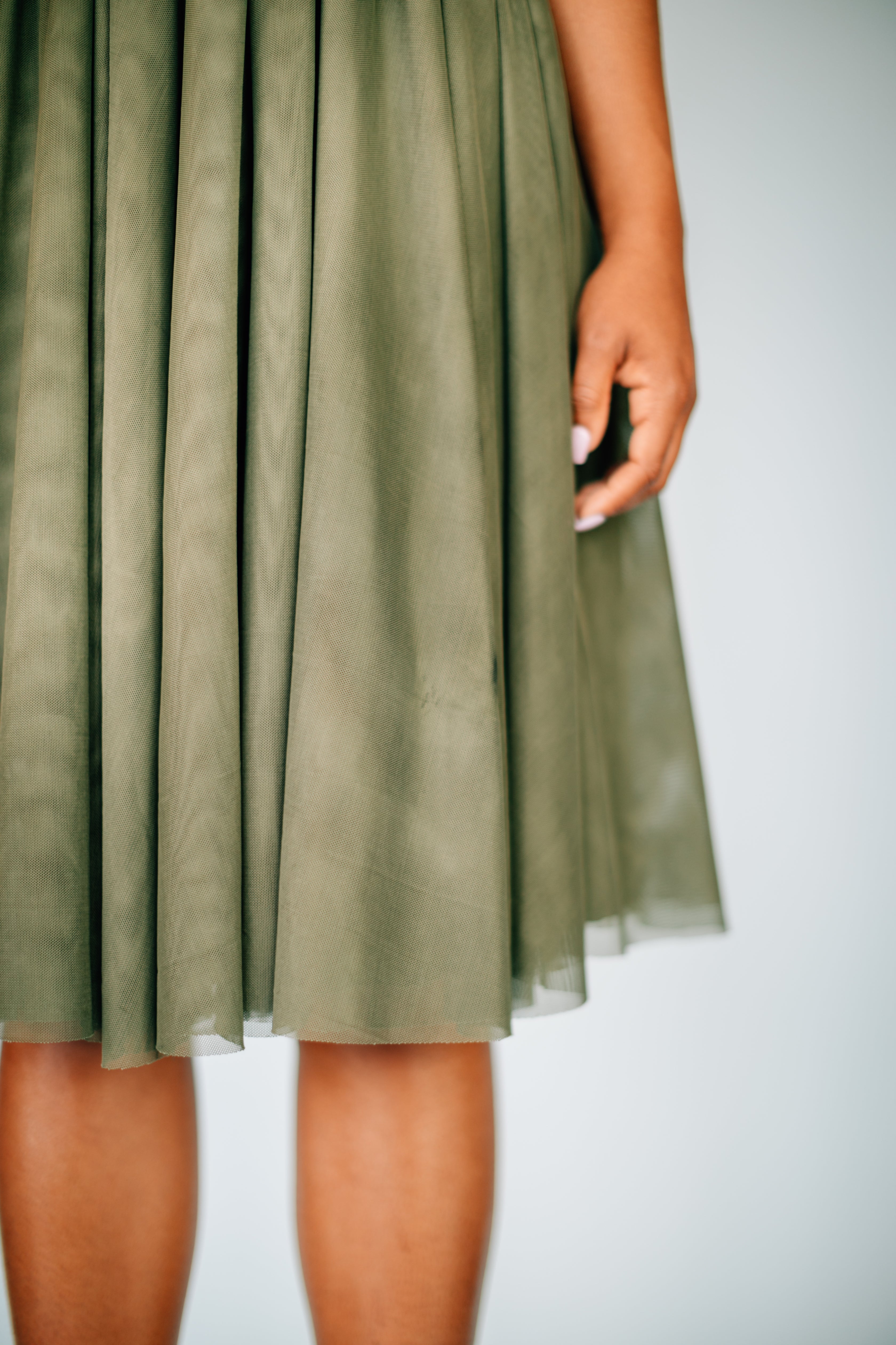Salmon Bella Sweet Pea skirt in soft pastel with pleated design, featuring a flowy, feminine style perfect for casual or dressy occasions.