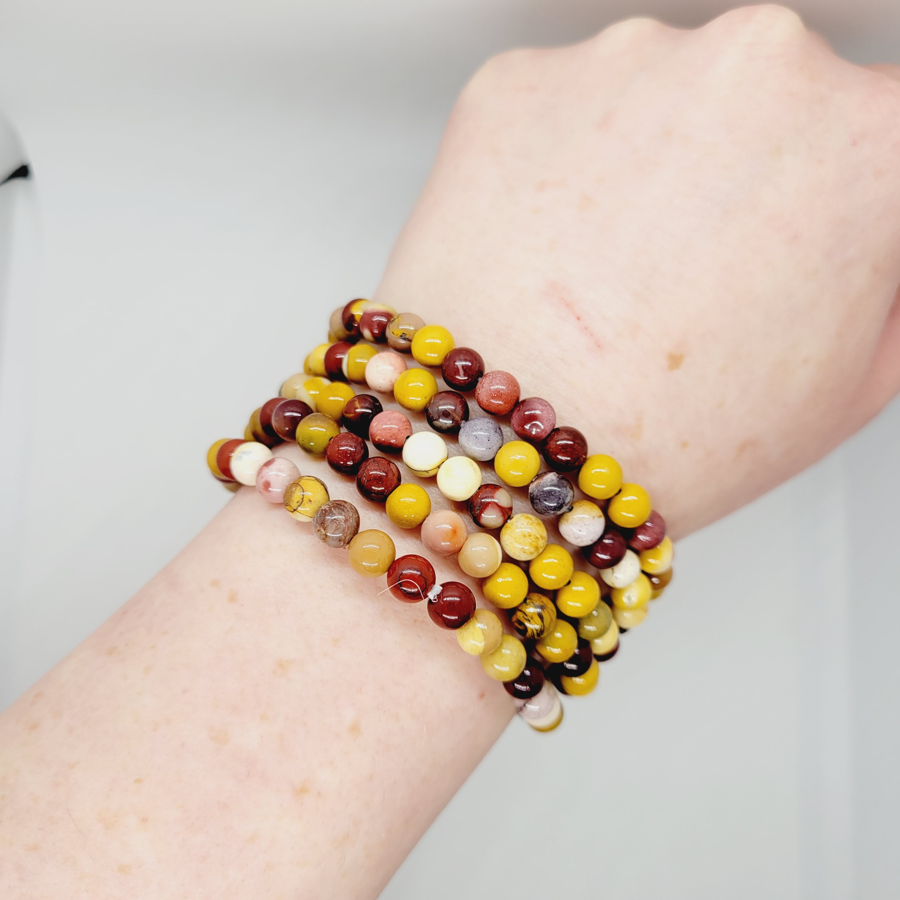 Mookite stone bracelet by Olive Coeus featuring vibrant, natural beads with a boho and metaphysical Reiki-inspired design.