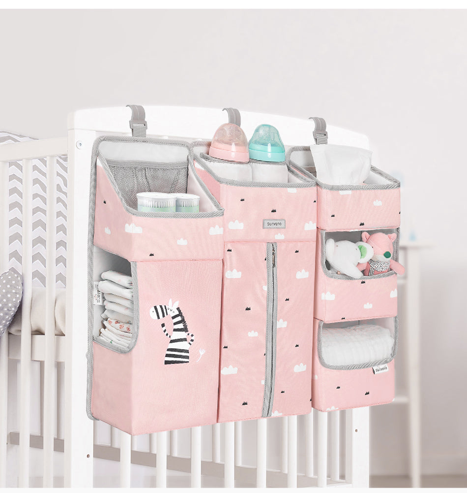 Maroon Chronos baby crib organizer with multiple compartments, nursery decor for kids and babies, hanging on a crib.